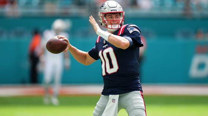 Patriots quarterback Mac Jones throws a pass in warmups before a game vs. the Dolphins.